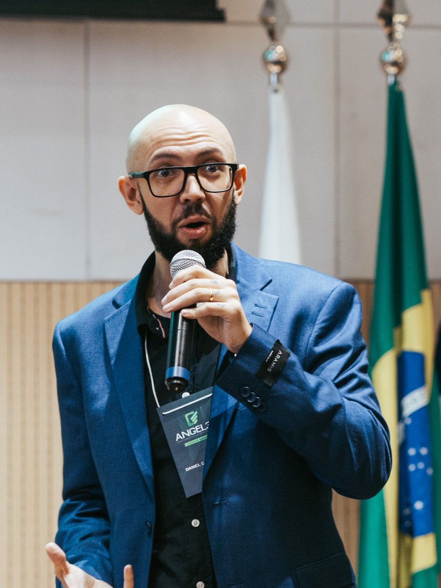 Daniel Constantino speaking on stage